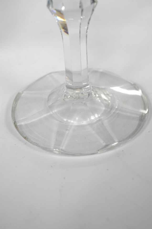 A DSOT stem goblet, circa 1765, with a cup shaped bowl, diamond point engraved ‘J Edden’and a facet stem wine glass, circa 1770, the round funnel bowl engraved with fruiting vines a chrysanthemum and a moth, 15.3cm and 1